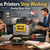 Office staff experiencing delays and frustration when a printer stops working during a busy workday